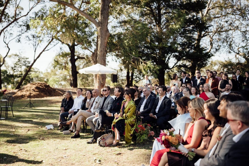 Melbourne wedding guests at Studley Grounds for a ceremony by Eddy Mac and photo by Liz Barnes